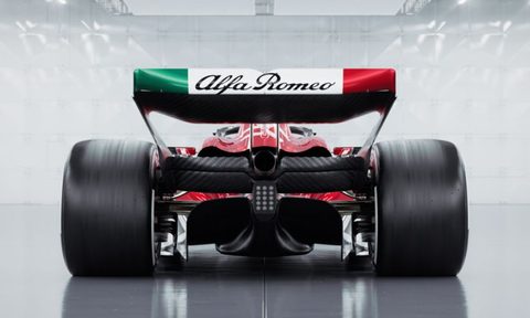Alfa Romeo final 2023 season Formula 1 race car rear view against a silver background that appears to be an F1 race pit lane garage.