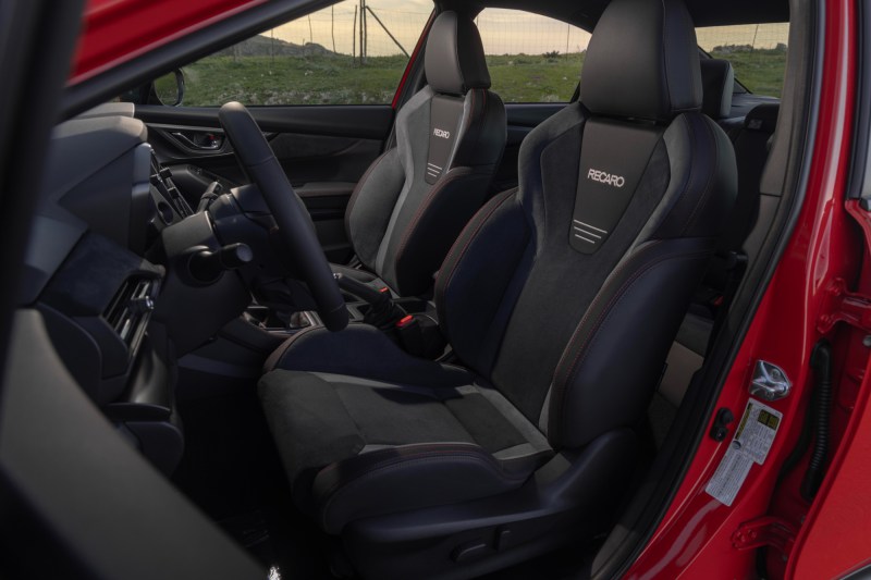 Interior of red 2024 Subaru WRX TR showing Recaro sport seats.