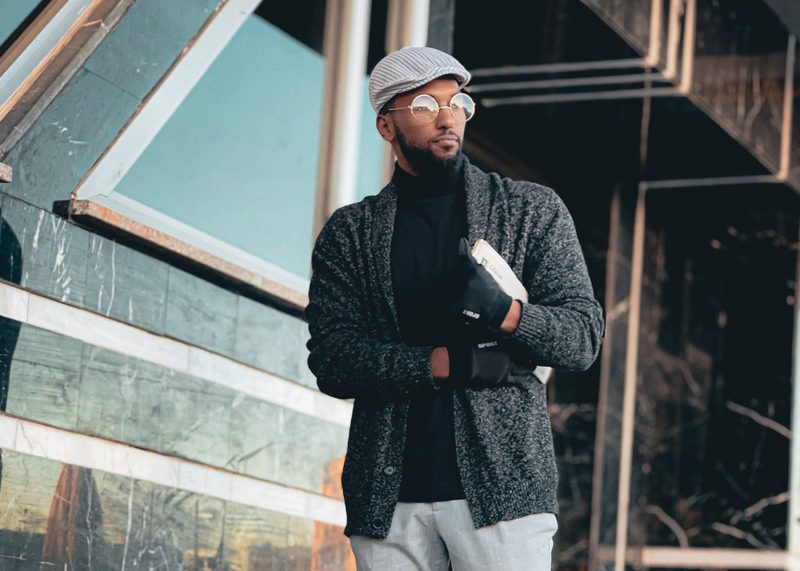 Man in cardigan and flatcap