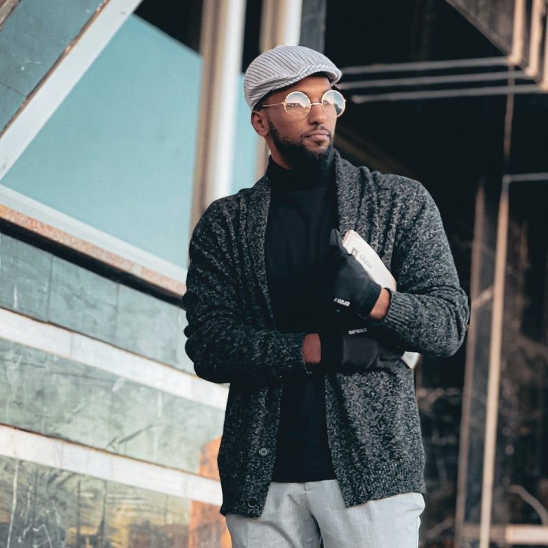 Man in cardigan and flatcap