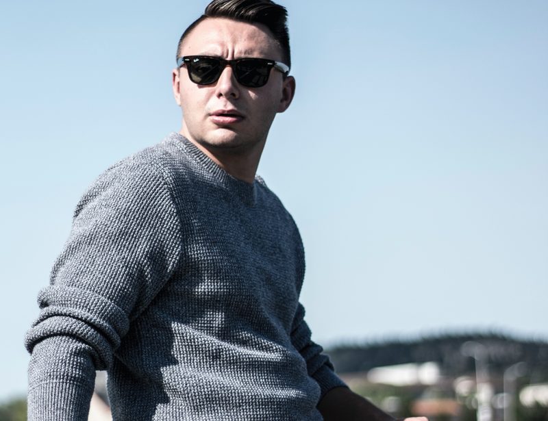 Man in sweater and sunglasses