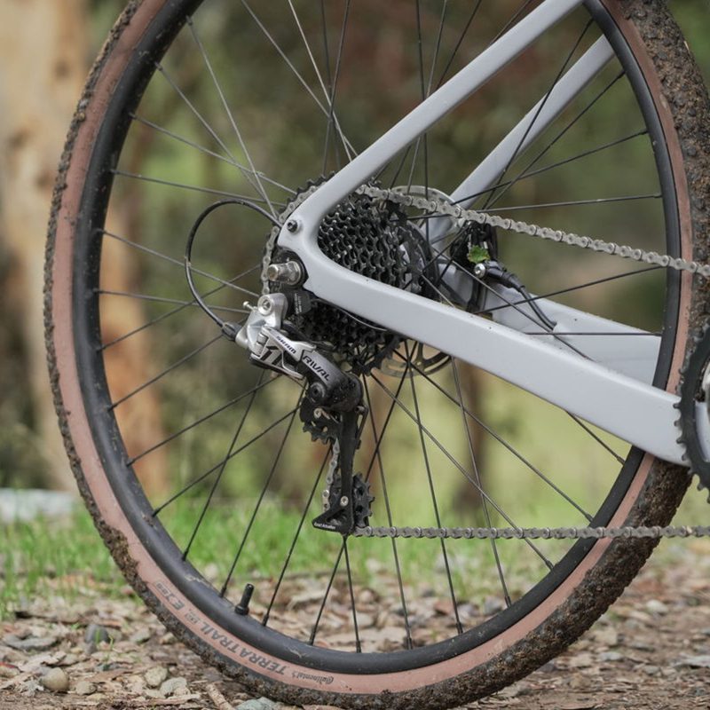 Ride1UP CF Racer1 rear wheel with derailleur and gear cassette.