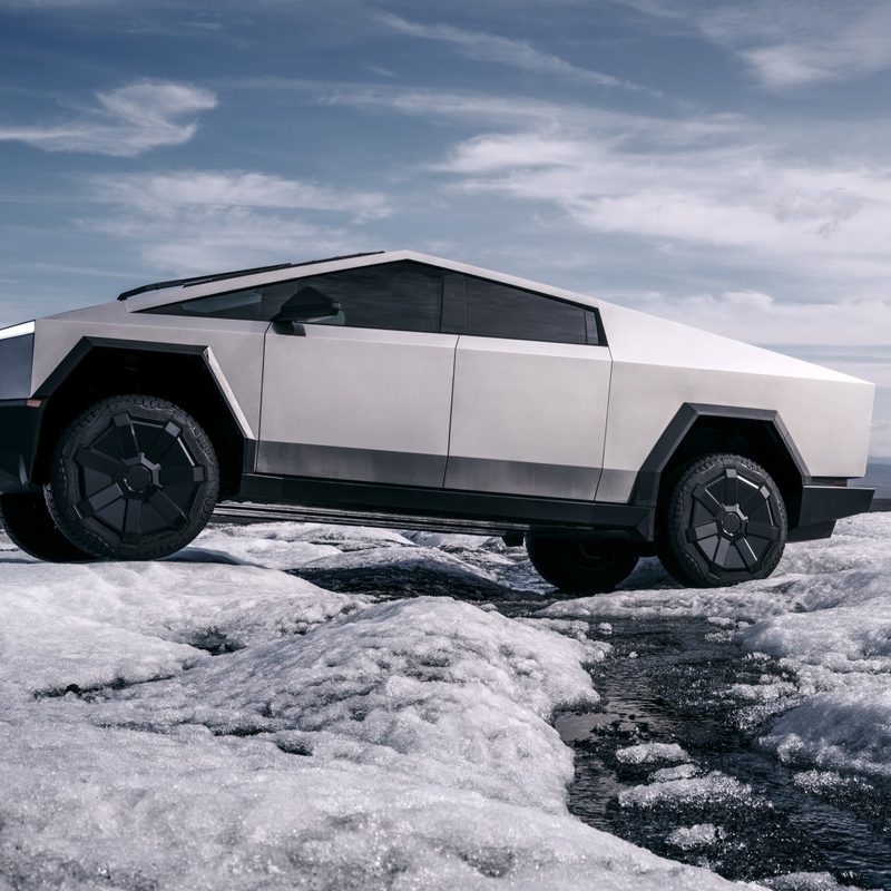 Tesla Cybertruck EV driving in snow