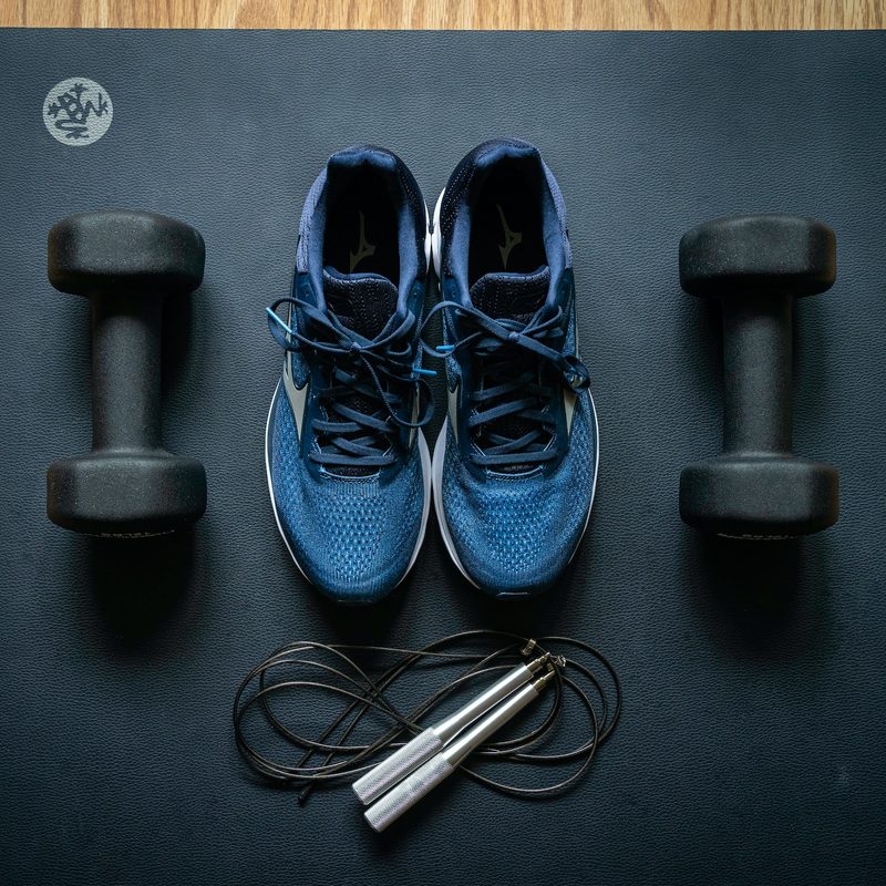 running shoes on exercise mat