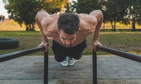 man doing calisthenics workout outside