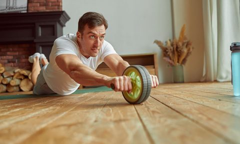 Man Using Outfit for Exercising Core Indoors