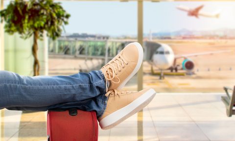 Close-up of young man waiting for the plane at an airport