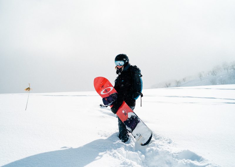 Snowboarder in powder wearing goggles