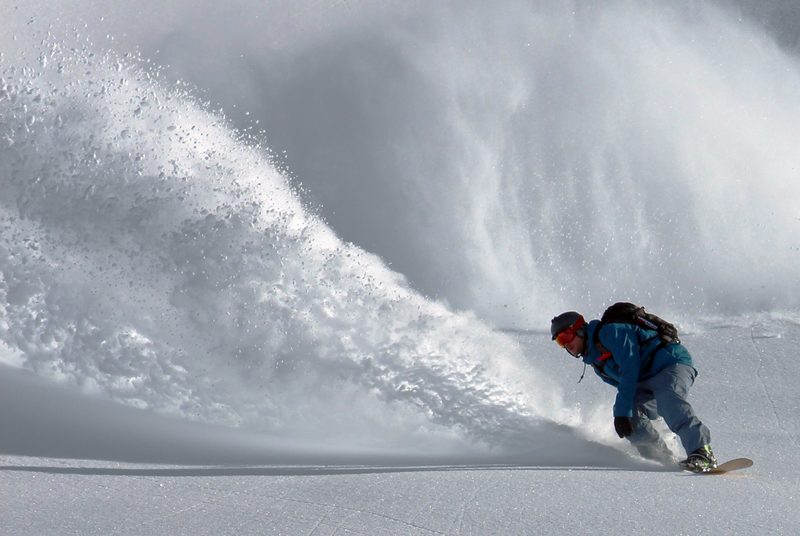 Snowboarder in deep powder