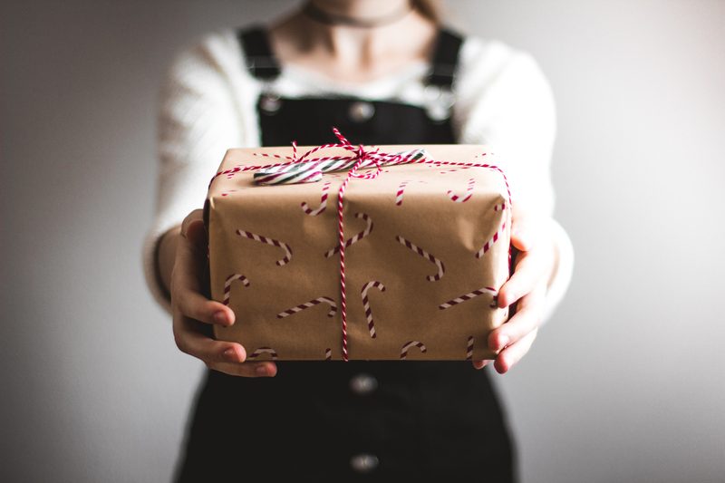 Person holding Christmas gift