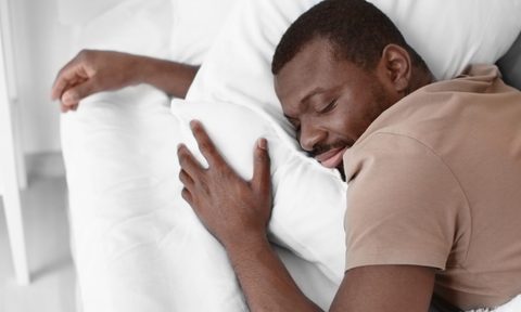Man sleeping in a T-shirt