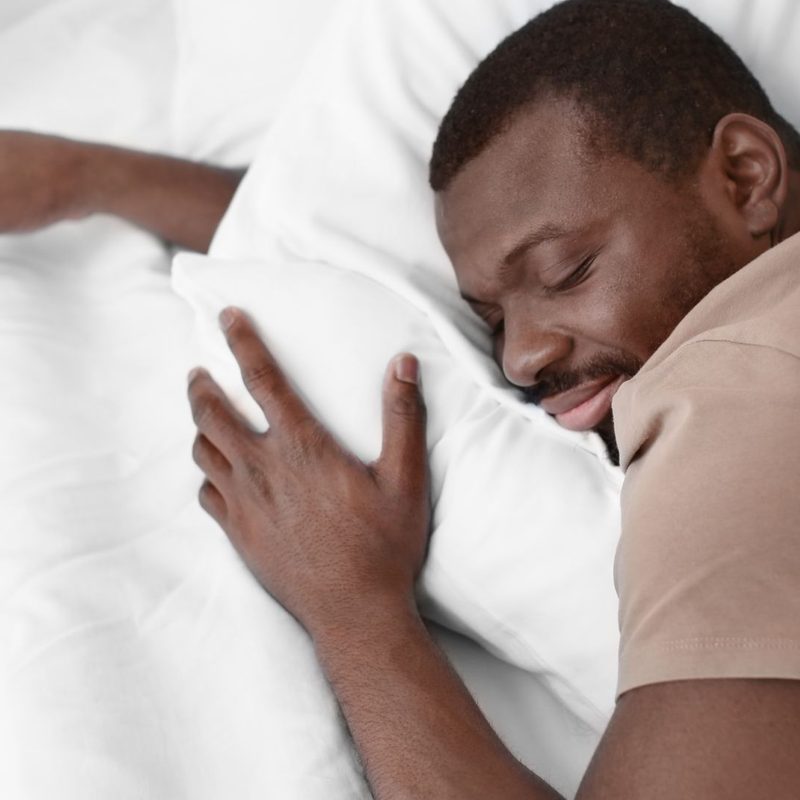 Man sleeping in a T-shirt