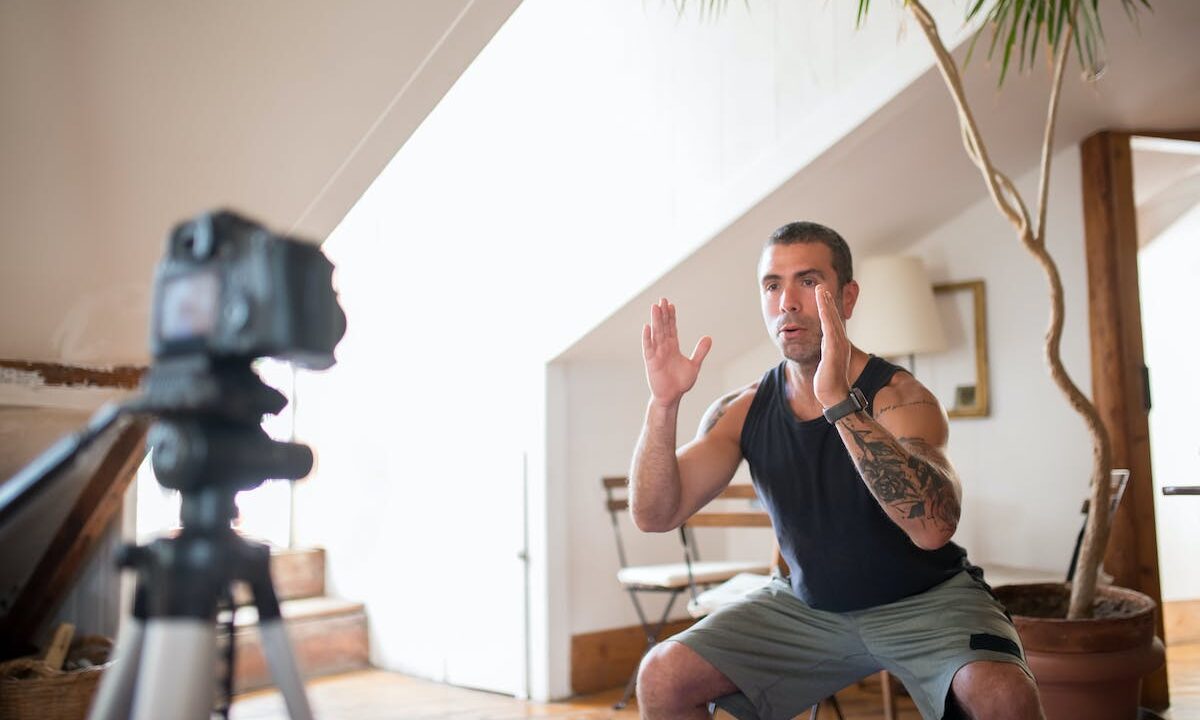 a man doing squats in front of camera
