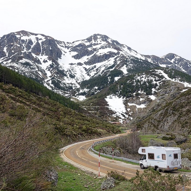 An RV driving through the mountains