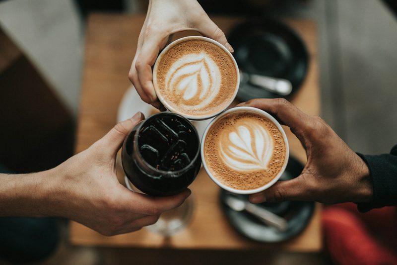 Coffee cups cheers-ing