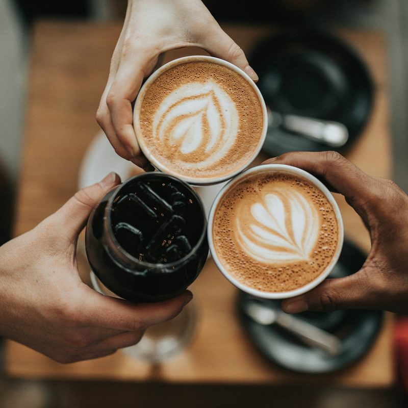 Coffee cups cheers-ing