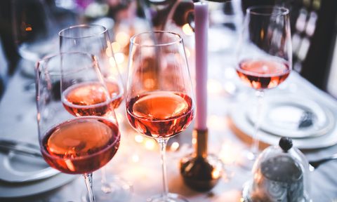 Glasses of rose on table
