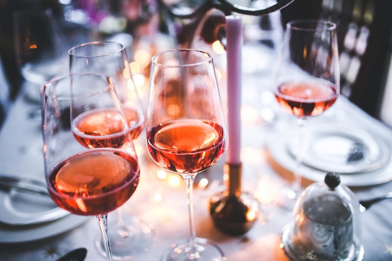 Glasses of rose on table