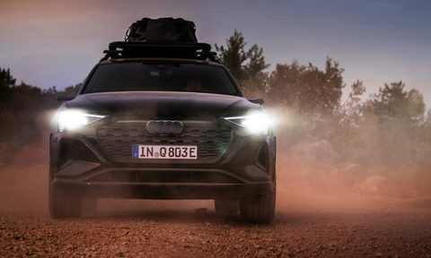 2024 Audi Q8 e-tron edition Dakar driving on a desert road directly toward the viewer