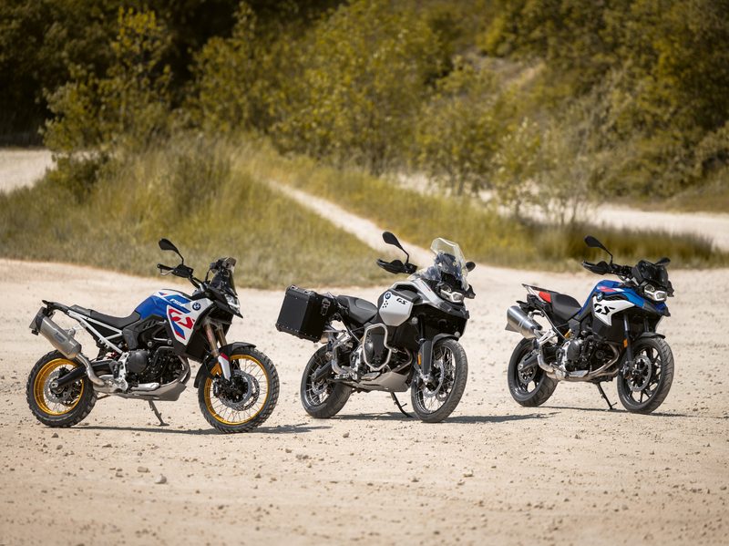 Three versions of the 2024 BMW F 900 GS motorcycle.