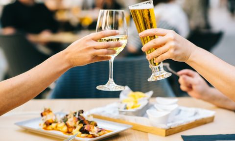 People toasting over plates