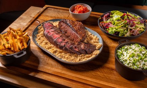Brazilian picanha on plate with sides.