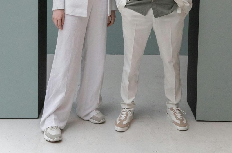 Couple wearing suits and sneakers