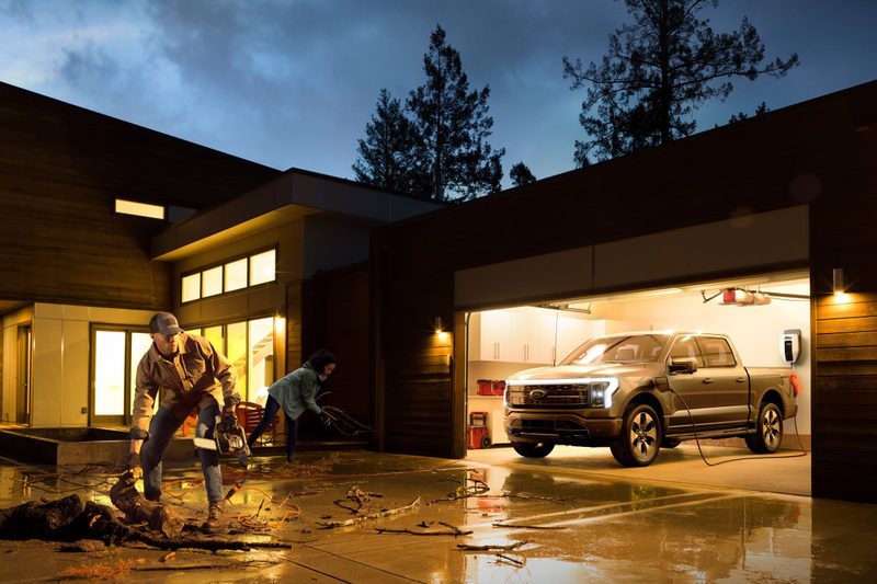 F150 Lightning powering a home at night.