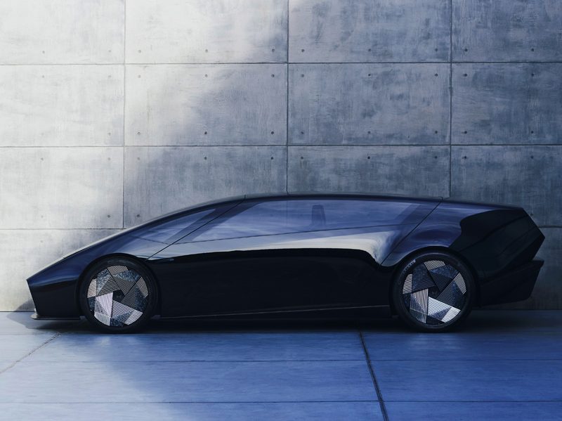 Honda 0 Saloon concept EV left side direct image against a concrete slab wall.