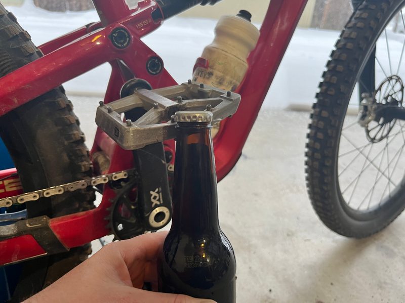 Using a mountain bike pedal to pop a beer cap off