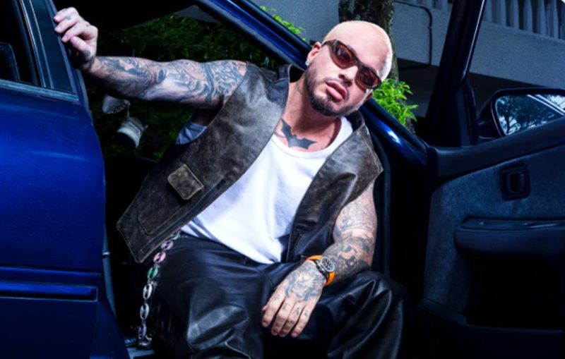 J. Balvin leaning out of car