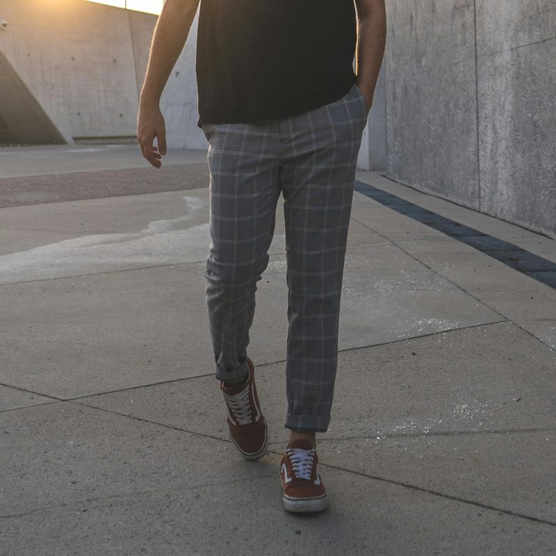 Man in dress pants and sneakers