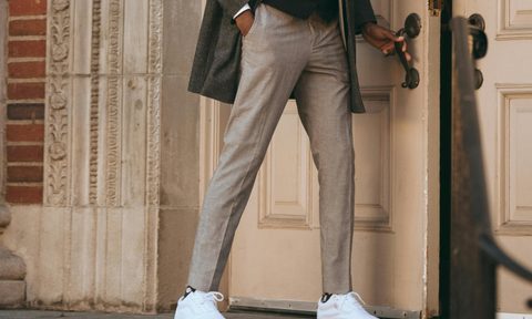 Man in dress pants and sneakers