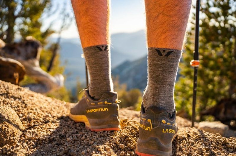 Man wearing Swiftwick Flite XT Trail Five