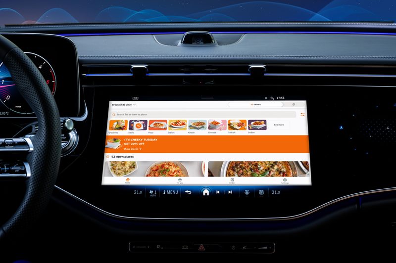 Mercedes-Benz MBUX center display expanded with multiple meal and menu options in restaurant search.