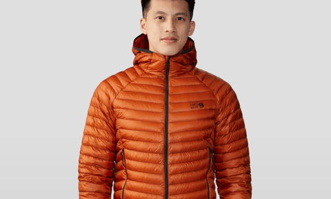 A man wearing the Mountain Hardwear Ghost Whisperer Jacket.