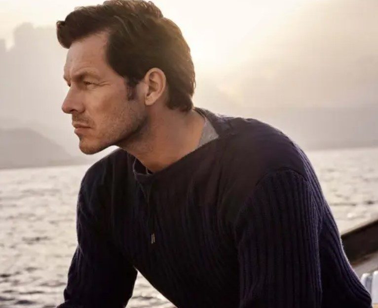 N. Peal London 007 Ribbed Army Sweater on a boat