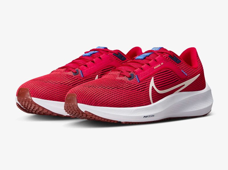 The Nike Pegasus 40 men's running shoes in red against a white background.