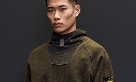 A Stone Island sweater on a male model.