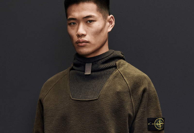 A Stone Island sweater on a male model.
