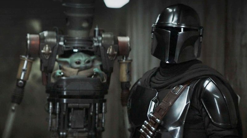 Grogu and The Mandalorian in a scene from The Mandalorian season 3.