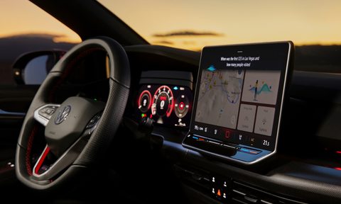 VW GTI concept shot of drivers cockpit and dashboard with ChapGPT answeringa question about the first CES.