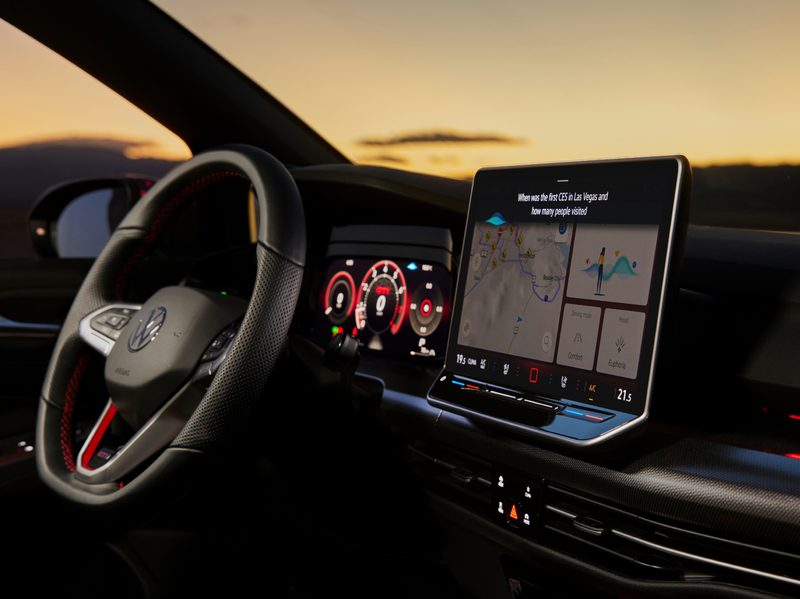 VW GTI concept shot of drivers cockpit and dashboard with ChapGPT answeringa question about the first CES.