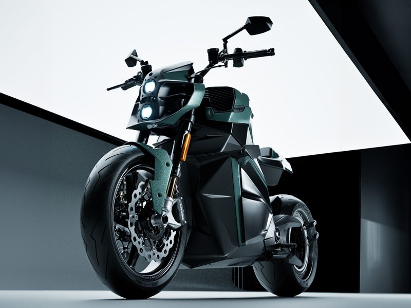 Verge TS Ultra motorcycle direct product shot from lower left front with greenish-gray background.
