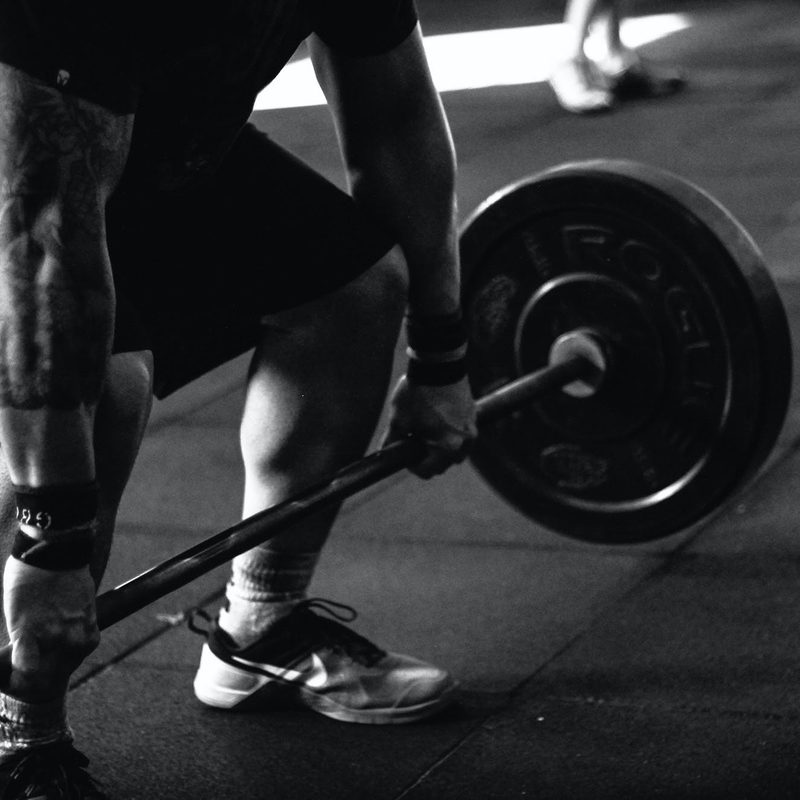 Man lifting barbell with weights
