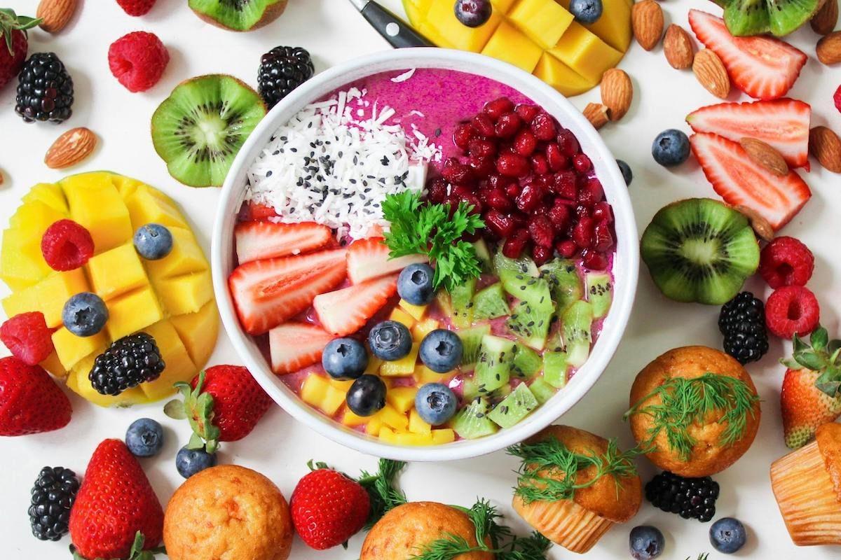 a bowl of berries and fruits