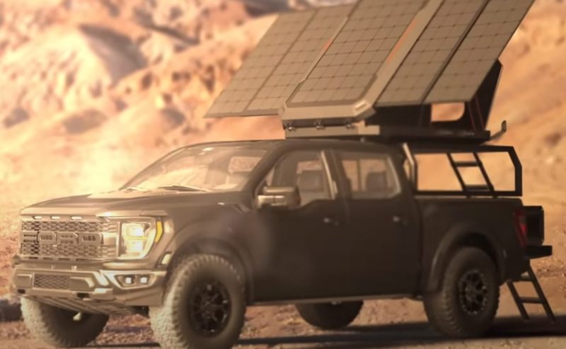 Pickup truck parked in the desert with a fully open Jackery solar rooftop tent.