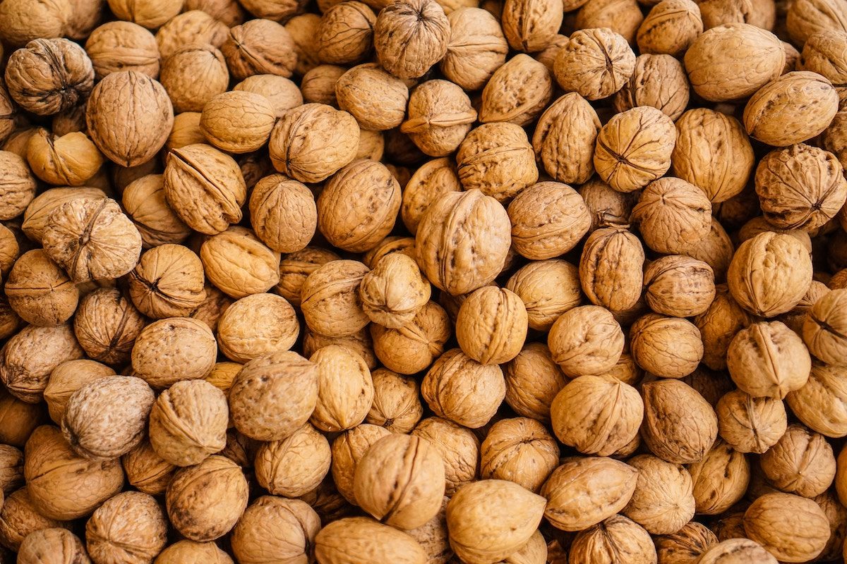 close up of a ton of walnuts