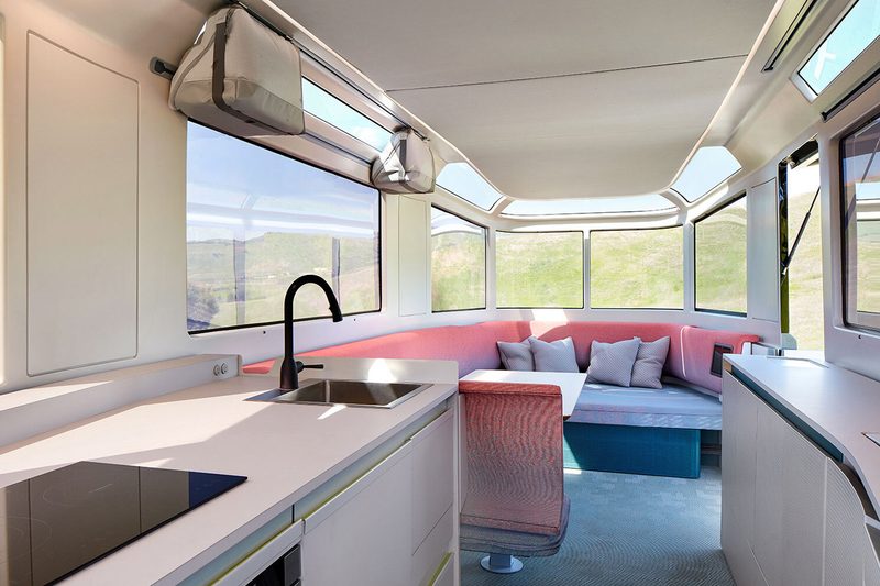 Bright, open-concept interior of the Lightship L1 all-electric travel trailer.