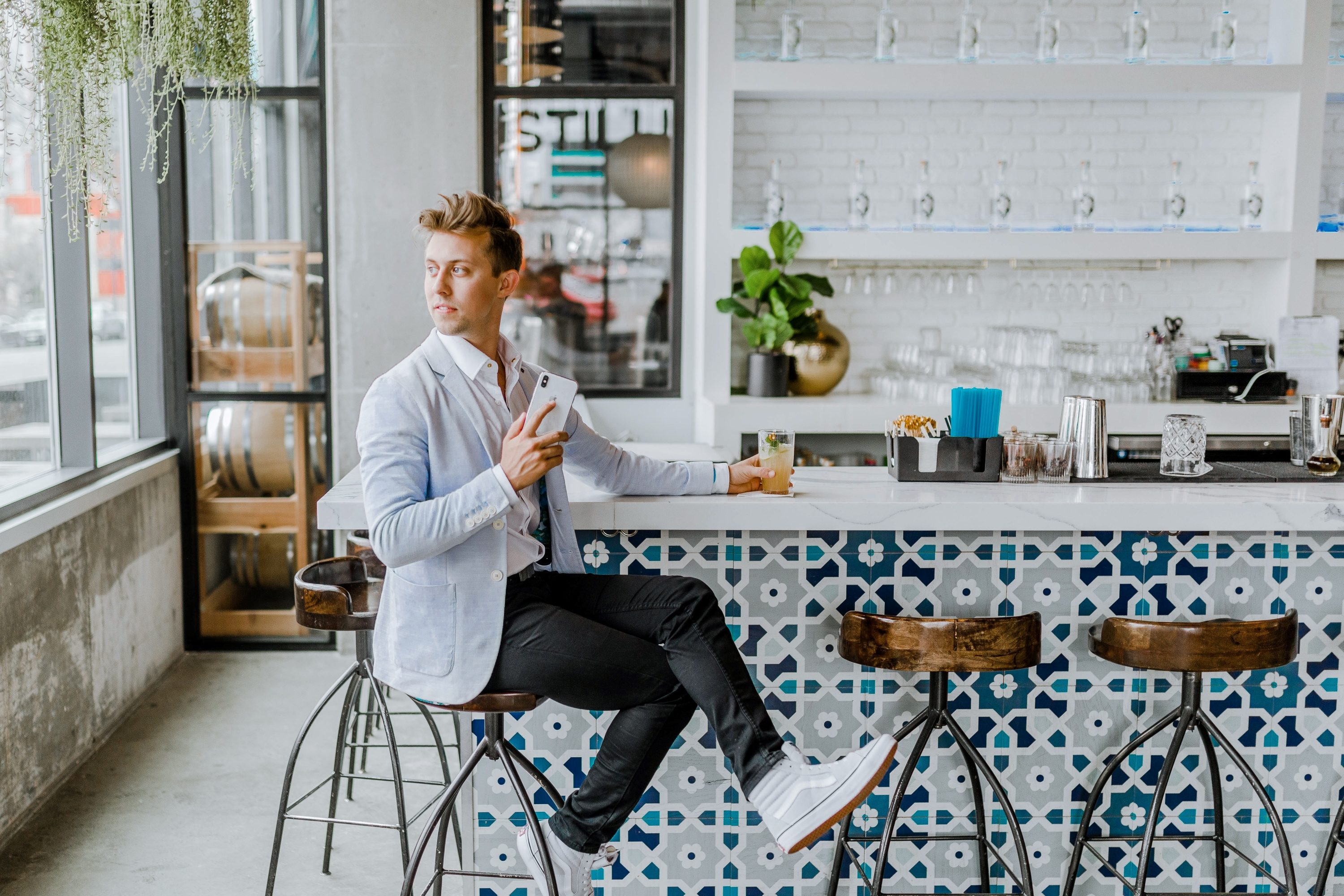 man sitting in kitchen in sport coat